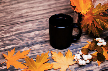 Little chorne miner with a drink on the background of a fresh aspen leaf