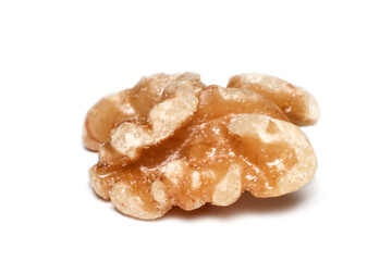Extreme close up shot of single walnut on white background