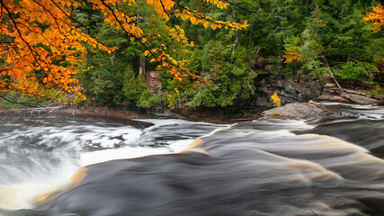 Running water at Black river national forest in Michigan upper peninsula during autumn time