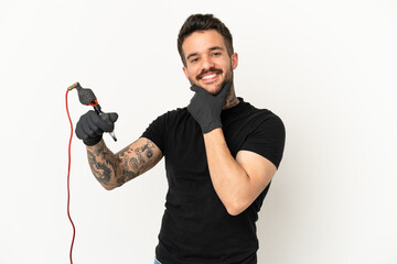 Tattoo artist man over isolated white background happy and smiling