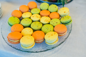 Festive buffet table with delicious desserts of different colors at the wedding ceremony