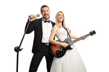 Beutiful bride playing a guitar and groom singing on a microphone