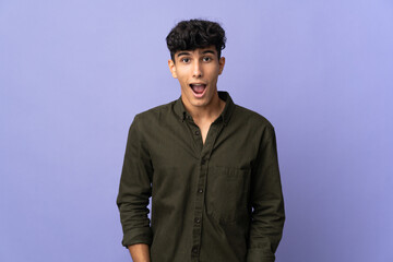 Fototapeta premium Young Argentinian man isolated on background with surprise facial expression