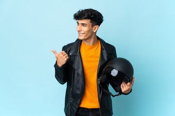 Argentinian man with a motorcycle helmet pointing to the side to present a product