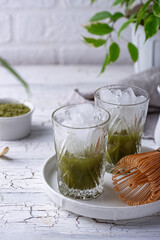 Cold matcha tea with milk and ice