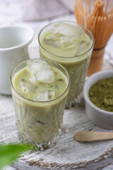 Cold matcha tea with milk and ice
