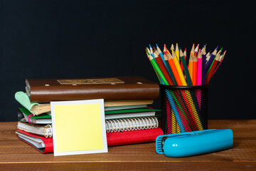 Sticker with space for text on the background of the educational installation. Textbooks, pencils....