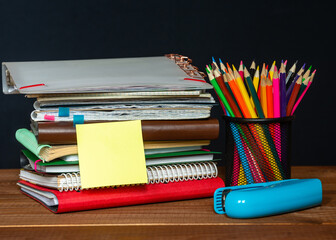 Sticker with space for text on the background of the educational installation. Textbooks, pencils....