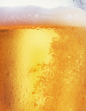 Closeup of beer in glass with condensation