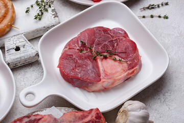 Raw uncooked ossobucco steak with spices