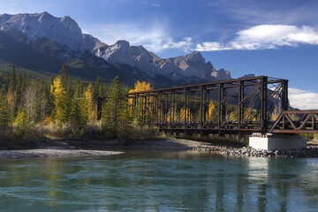 Engine Bridge, an old Iron Truss Railway Structure, relic of mining Bygone Days across Bow River in...