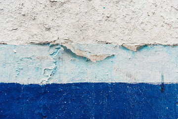Peeling blue and white paint covering a concrete wall. Vector cement texture