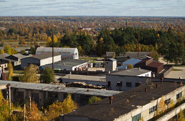 Fototapeta premium Aerial view of old industrial buildings in autumn day, Kuldiga, Latvia.