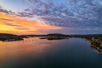 Sunrise waterscape and clouds with reflections
