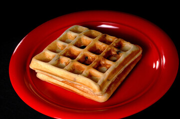 Two Blueberry Waffles On Red Plate