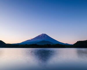 Morning light over Mount Fuji from lake Shoji, Yamanashi Prefecture, Japan