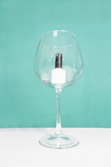 gel nail polish is located in a wine glass. The choice of nail polish. Creative beauty salon. Nail salon.

