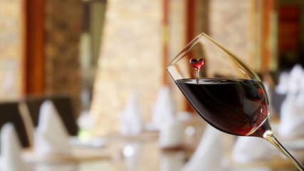 3D Rendered Red Wine With Heart Shaped Splash in a Glass Isolated on Blurred Background