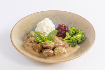 Swedish meatballs with creamy gravy, mashed potatoes and lingonberry sauce.