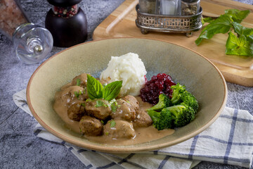 Swedish meatballs with creamy gravy, mashed potatoes and lingonberry sauce.