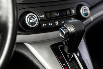 Close-up view of the automatic gearbox lever. Interior car,  automatic transmission gearshift stick