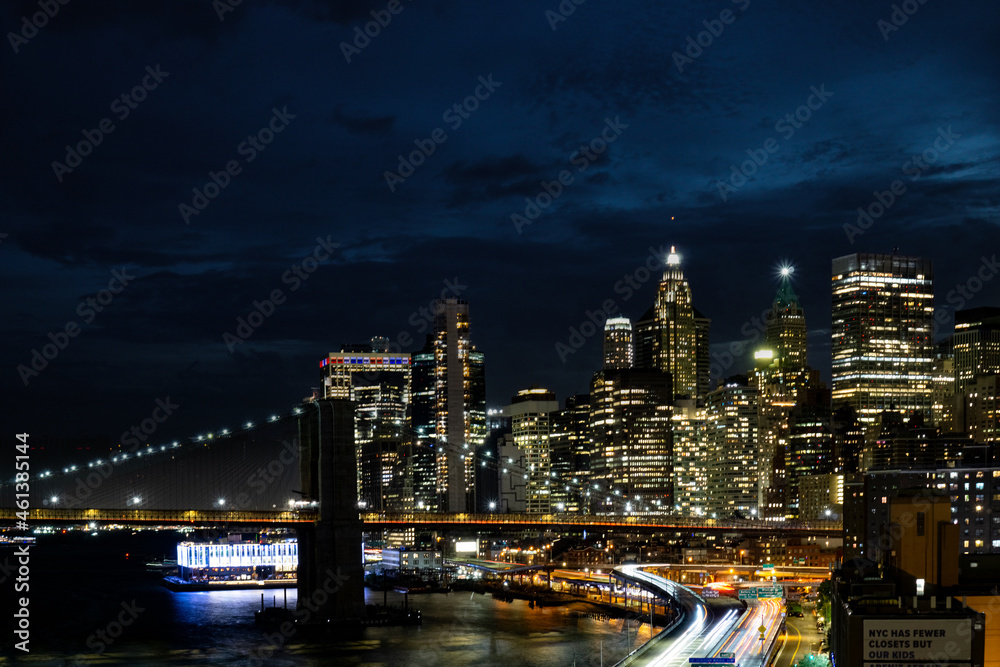 Sticker view of lower manhattan and financial district at night.