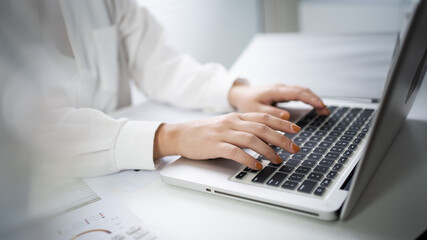 Woman working by using a laptop computer&nbsp;Hands typing on keyboard. writing a blog. Working at home are in hand finger typewriter