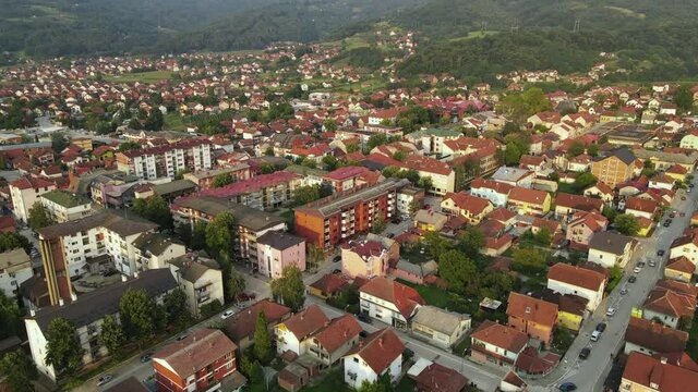 Bajina Basta, Serbia. Drone Aerial View, Buildings in Cityscape on Sunny Summer Evening, Tilt Up