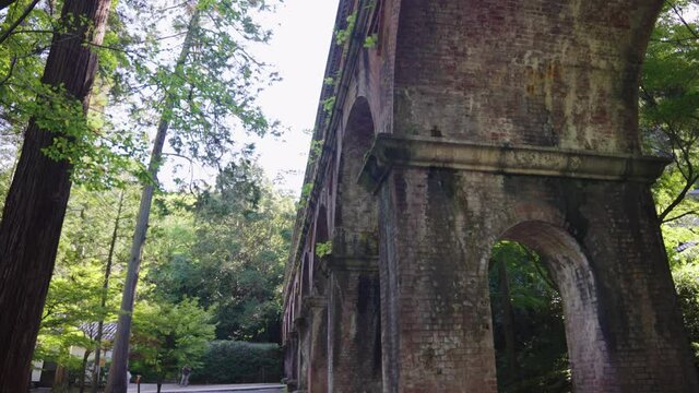 Arches of the Suirokaku Aqueduct tilt down reveal of ancient architecture