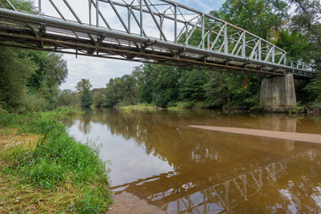 A metal suspended Bridge over the Bóbr river in Sagan town (Polish: Żagań) © Damian Pawlos
