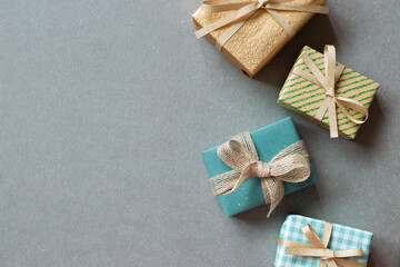 Colorful gift boxes on gray background. flat lay, top view, copy space
