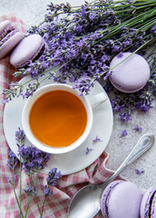 Cup of tea with macaroon dessert with lavender flavor