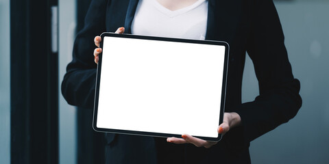 A Woman excited surprise and showing digital tablet white screen. Blank screen for your advertising.