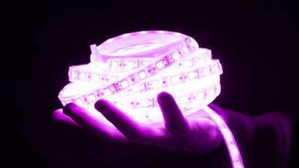 decorative led diode strip magenta color in hand.