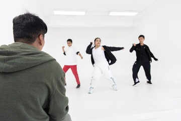 dance teacher training watching kids practice dancing in dance studio classroom