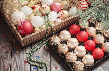 Christmas balls in box on dark wooden background