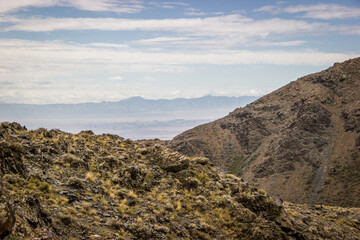 Beautiful Summer scenery: rocky mountains under the blue cloudy sky
