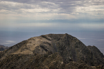 Beautiful Summer scenery: rocky mountains under the blue cloudy sky