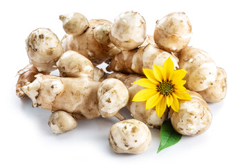 Jerusalem artichoke roots with leaves and flower of Jerusalem artichoke isolated on white background.