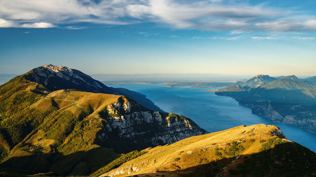 Mountain monte baldo at sunrise with lake garda and sirmione in the background. Early morning