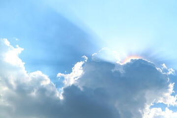 Fantastic Sunbeam Shining Through the Fluffy Cumulus Clouds