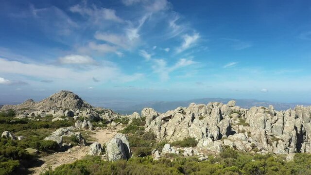 View from above, flying over a granitic mountain range during a sunny day. Mount Limbara (Monte Limbara) Sardinia, Italy.