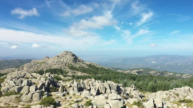 View from above, flying over a granitic mountain range during a sunny day. Mount Limbara (Monte Limbara) Sardinia, Italy.