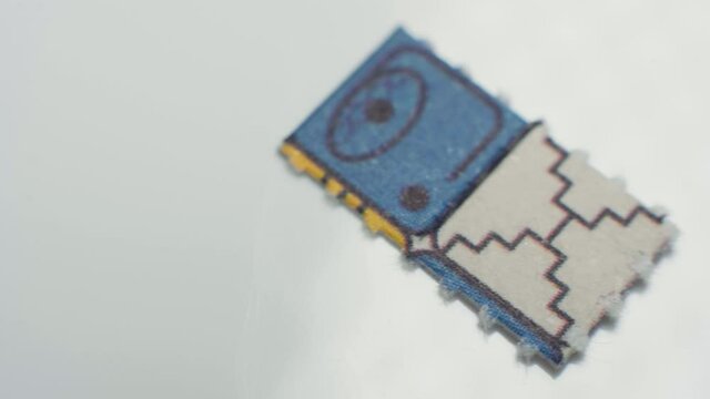 4K Macro shot of two acid tabs of LSD.