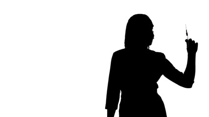 Photo of the woman's silhouette with syringe