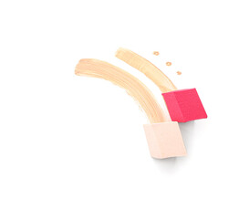 Stylish makeup sponges and foundation samples on white background