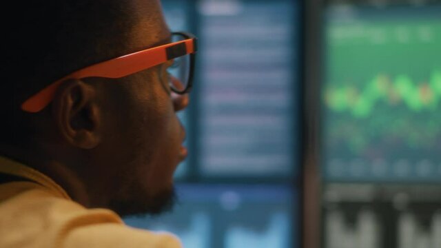 Crypto currency trader analyzing data