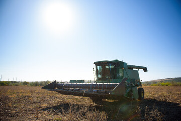 Fototapeta premium Harvester in a field for harvesting in autumn.