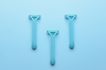Safety razors on blue background