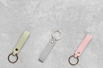 Leather keychains on grey background